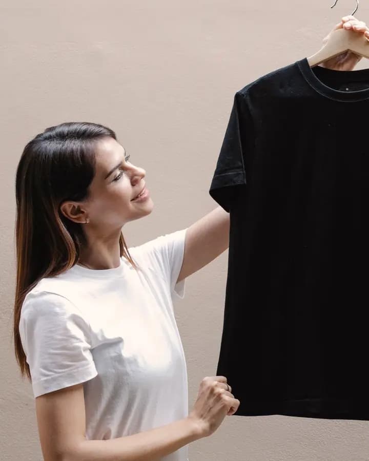 Creator looking at a blank T-shirt for a new design